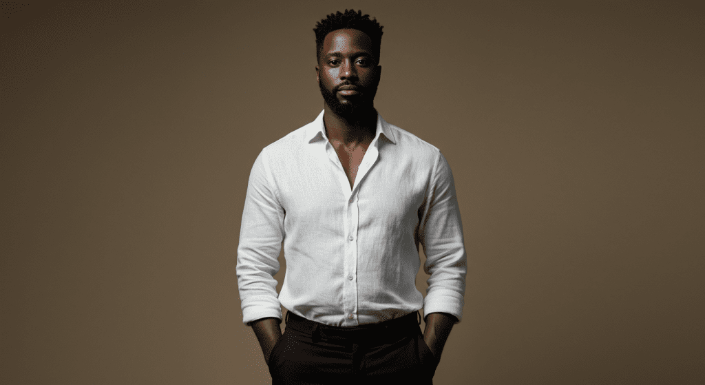 Confident black man standing tall with a relaxed posture, symbolizing empowerment and overcoming personal challenges.