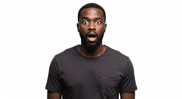 A black man with a shocked expression on his face